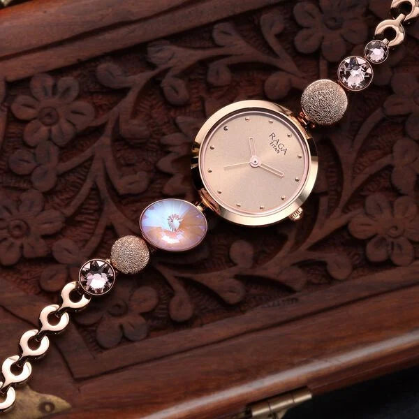 Raga Women's Charm: Elegant Mother of Pearl Dial with Ornate Strap Watch NT2606WM08